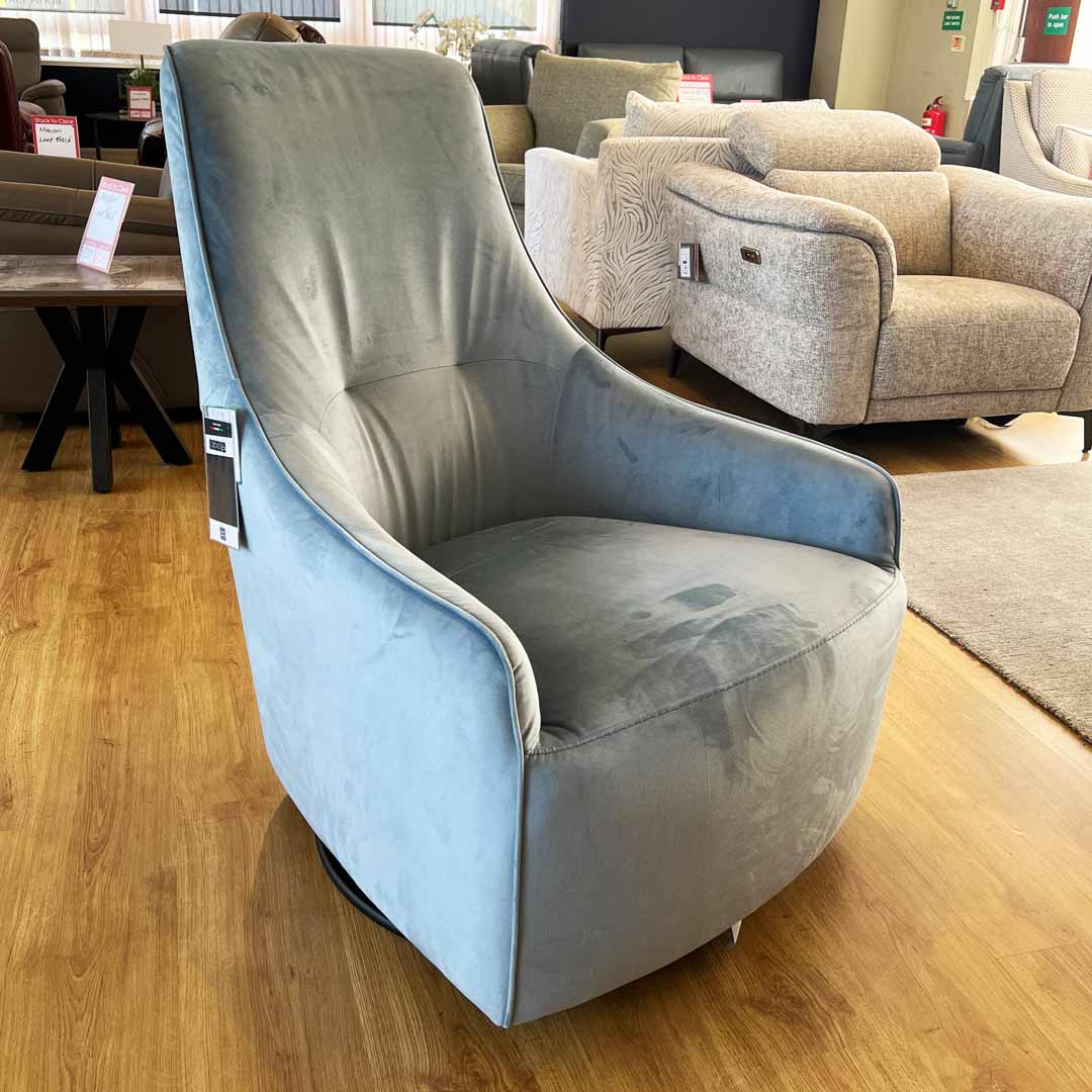Cozenza swivel arm chair in blue velvet fabric. Designer Italian made relaxer chair