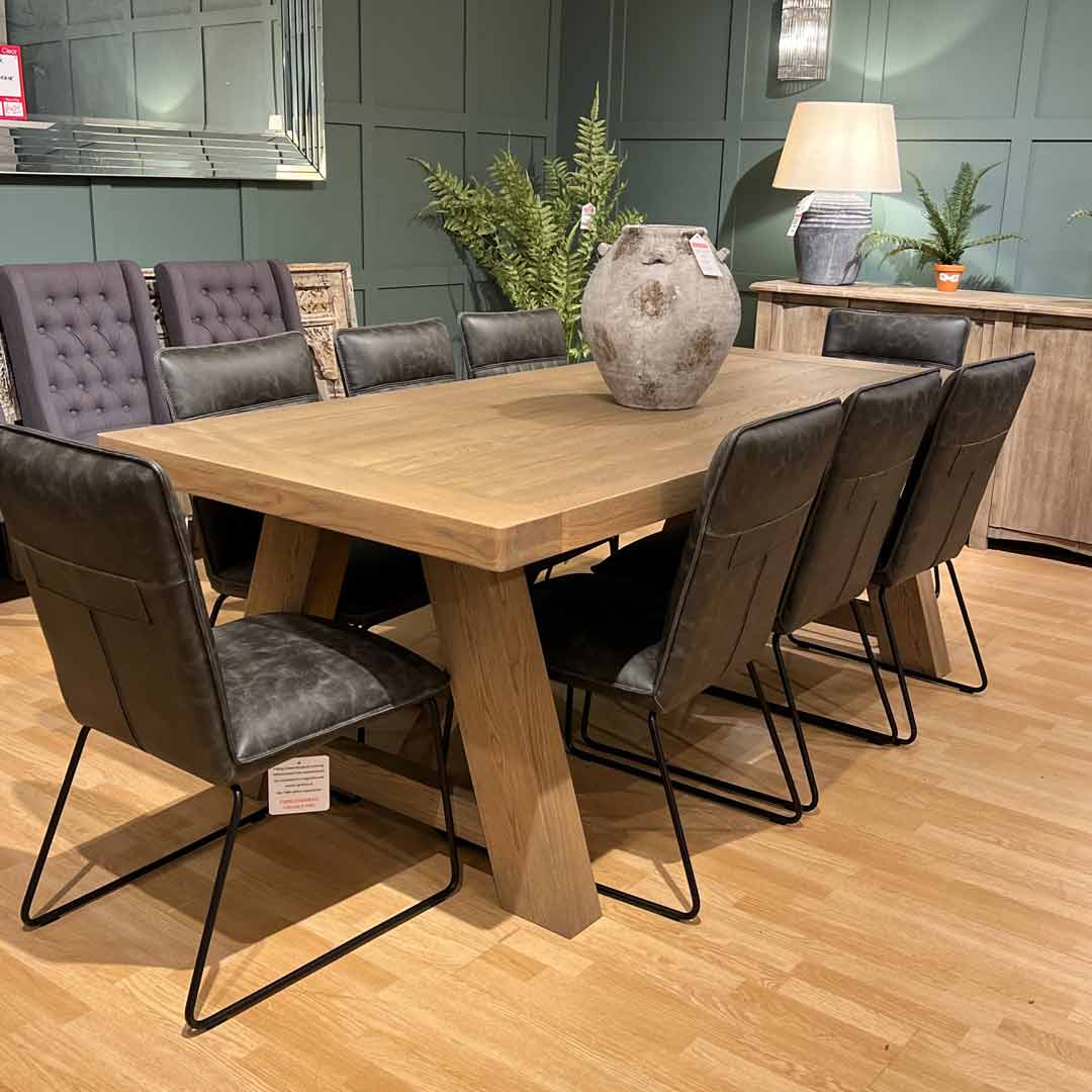 Trent oak dining table and 7 cooper dining chairs in grey faux leather